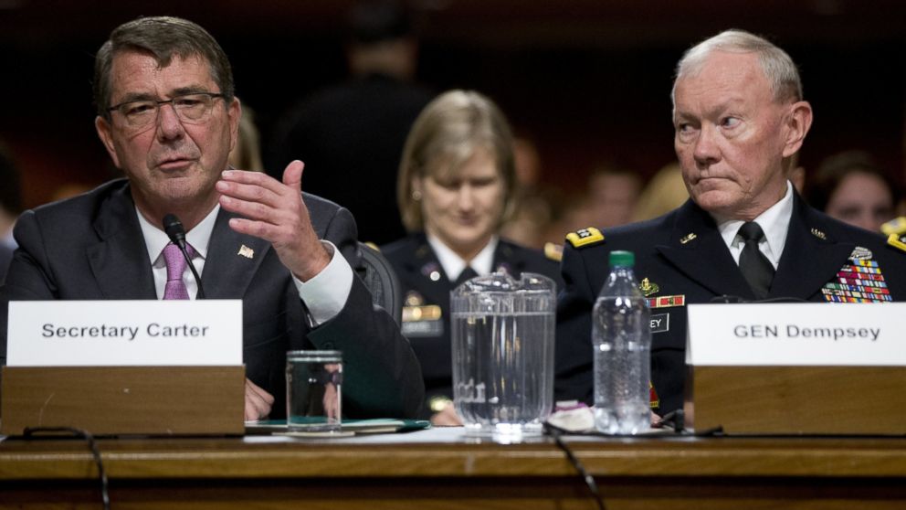 Chairman of the Joint Chiefs of Staff, Gen. Martin Dempsey, right, looks to Defense Secretary Ash Carter, left, as he testifies at the Senate Armed Services Committee hearing on Capitol Hill in Washington, D.C. on July 7, 2015.