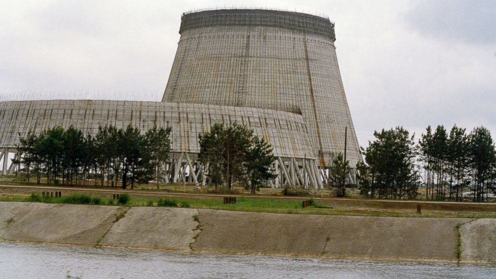 PHOTO: Reactor No. 4 of the Chernobyl nuclear power plant stands encased in lead and concrete following the accident in April 1986, that released a cloud of radiation that circled the world in Pripyat, Ukraine, July 1988. 