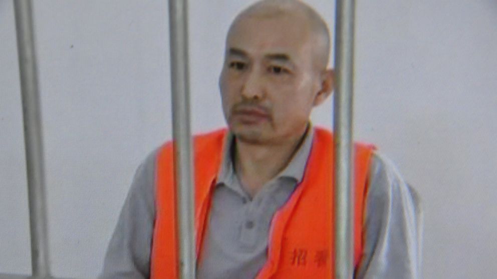 This screen shot, taken on May 31, 2014, shows Zhang Lidong being detained by police. Lidong was part of a group that killed a woman at a McDonald's restaurant in Zhaoyuan, China on May 28, 2014.