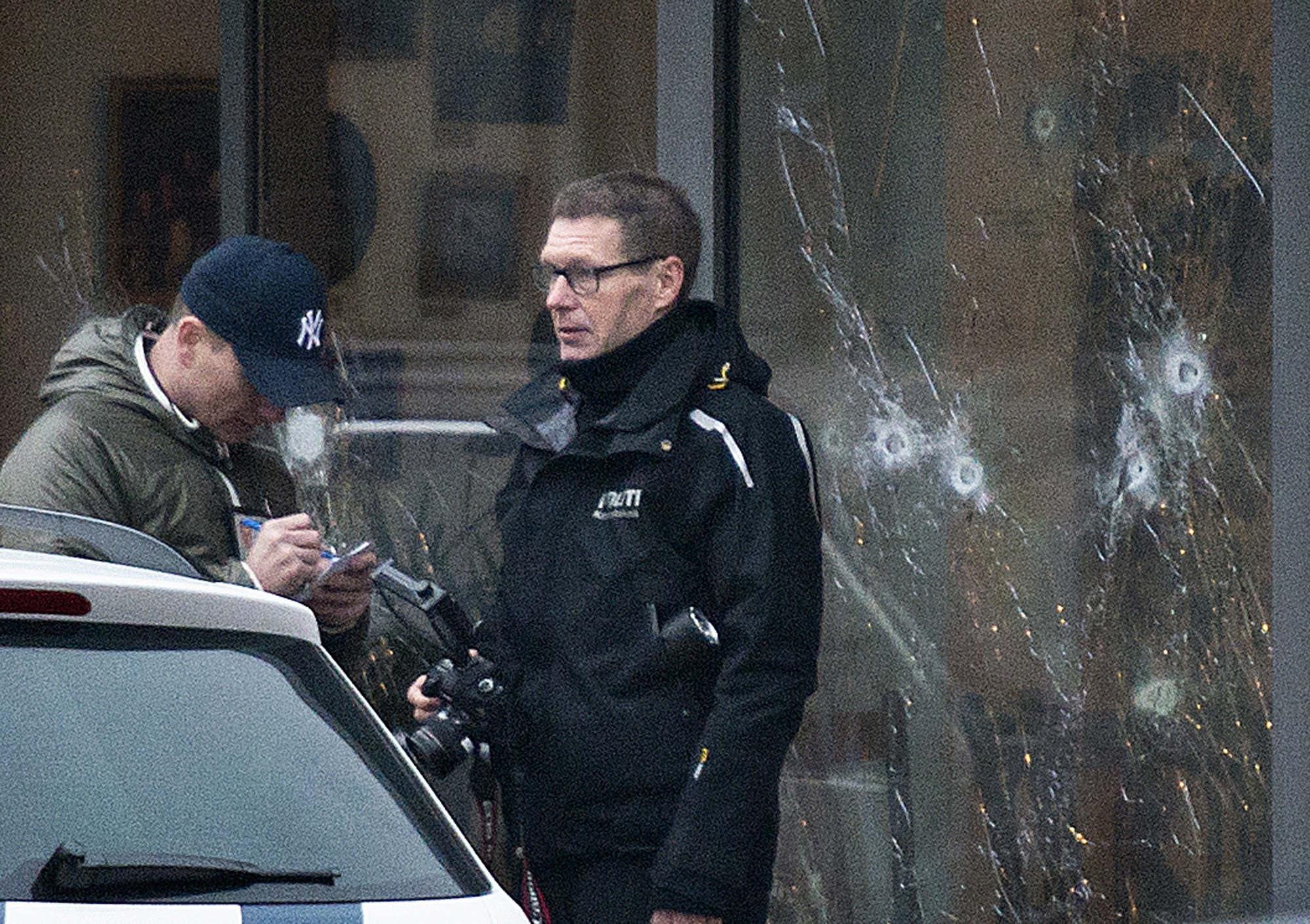 PHOTO: The scene outside the Copenhagen cafe, with bullet marked window, where a gunman opened fire Saturday, Feb. 14, 2015.