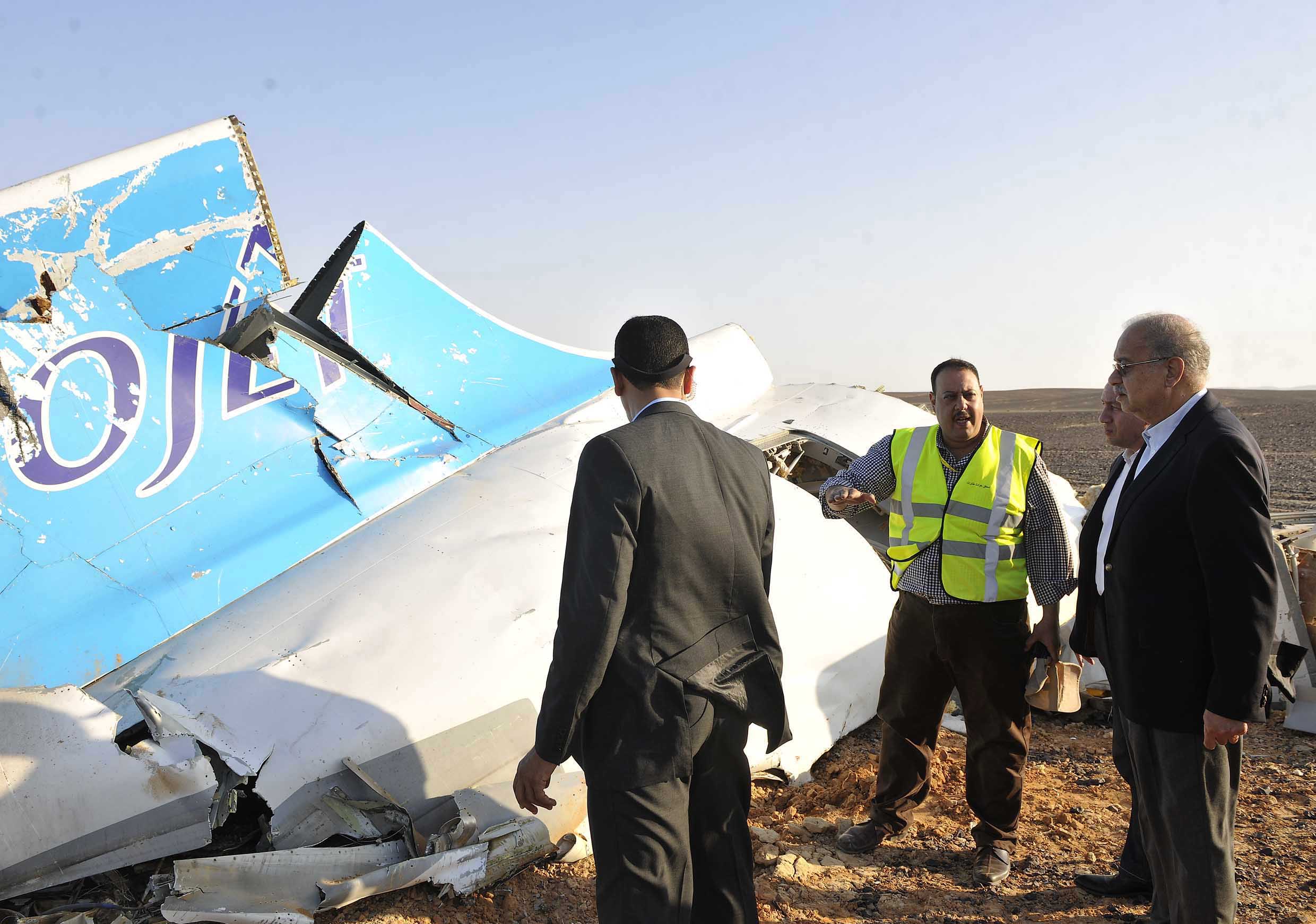 PHOTO: In this image released by the Prime Minister's office, Sherif Ismail, right, looks at the remains of a crashed passenger jet in Hassana Egypt, Oct. 31, 2015.