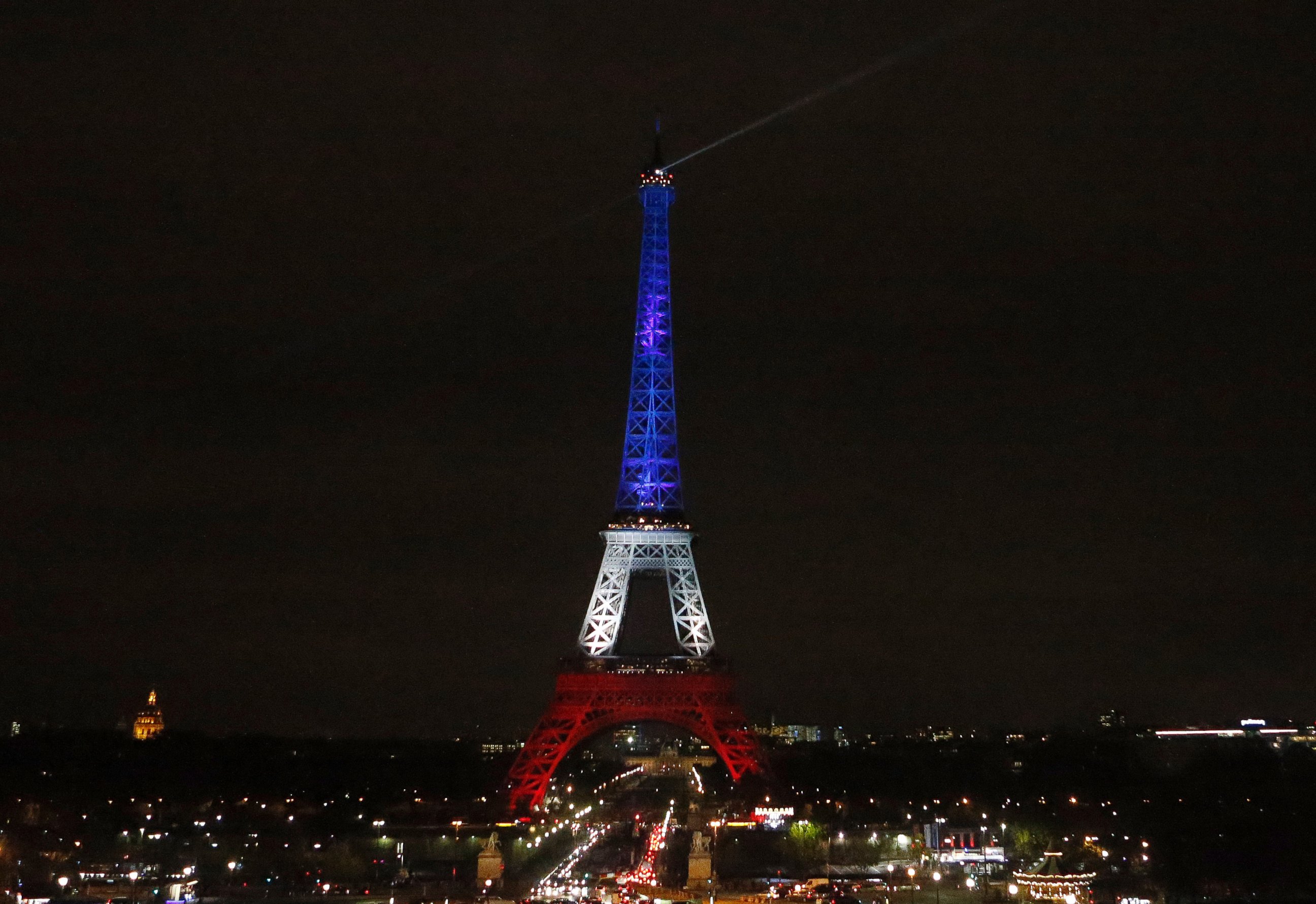 PHOTO: The Eiffel Tower is illuminated in the French national colors red, white and blue in honor of the victims of the terror attacks in Paris, Nov. 16, 2015. 