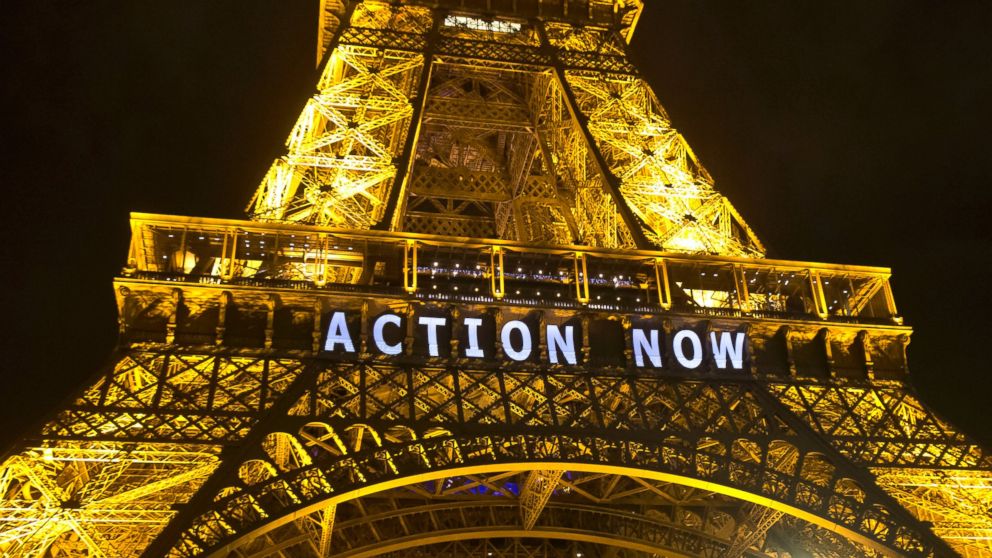The Eiffel Tower lights up with the slogan "Action Now" referring to the COP21, United Nations Climate Change Conference in Paris, Dec. 6, 2015.