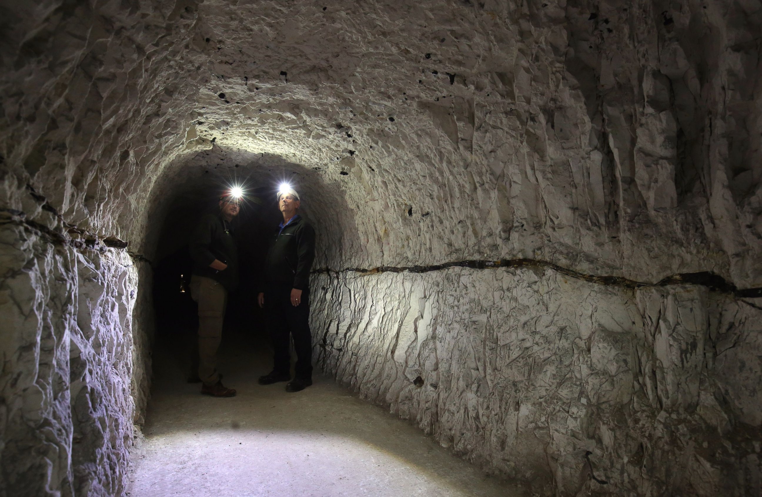 PHOTO: National Trust Project Manager Jon Barker and volunteer Gordon Wise exploreg the tunnels of the Fan Bay Deep Shelter, July 15, 2015, in Dover, Kent, as they are prepared to be opened to the public. 