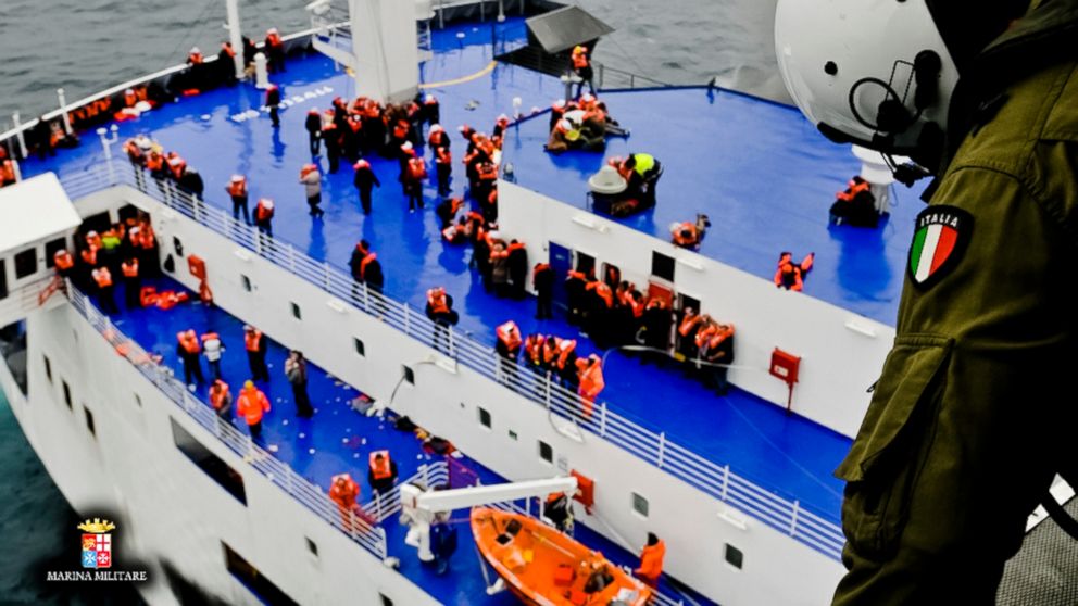 PHOTO: In this image released by the Italian Navy, passengers and crew are seen on the deck of the Italian-flagged ferry Norman Atlantic as it is approached by a rescue helicopter after it caught fire in the Adriatic Sea, Dec. 28, 2014. 