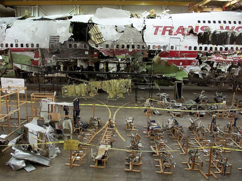 PHOTO: The seats, foreground, and the wreckage of TWA Flight 800 sit in a hangar in Calverton, N.Y. on July 16, 2001.