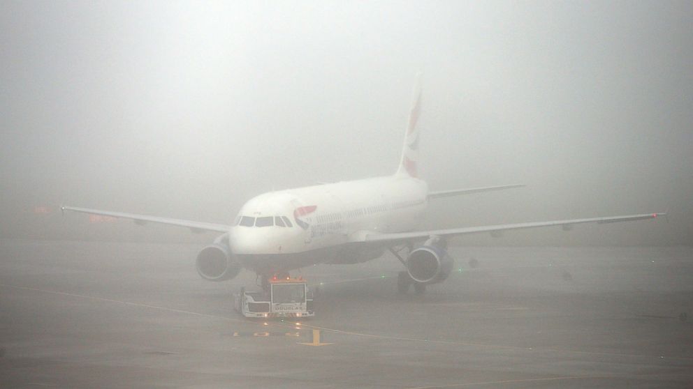 PHOTO: A British Airways plane seen through fog at Terminal 5 Heathrow Airport, London, Nov. 2, 2015. 