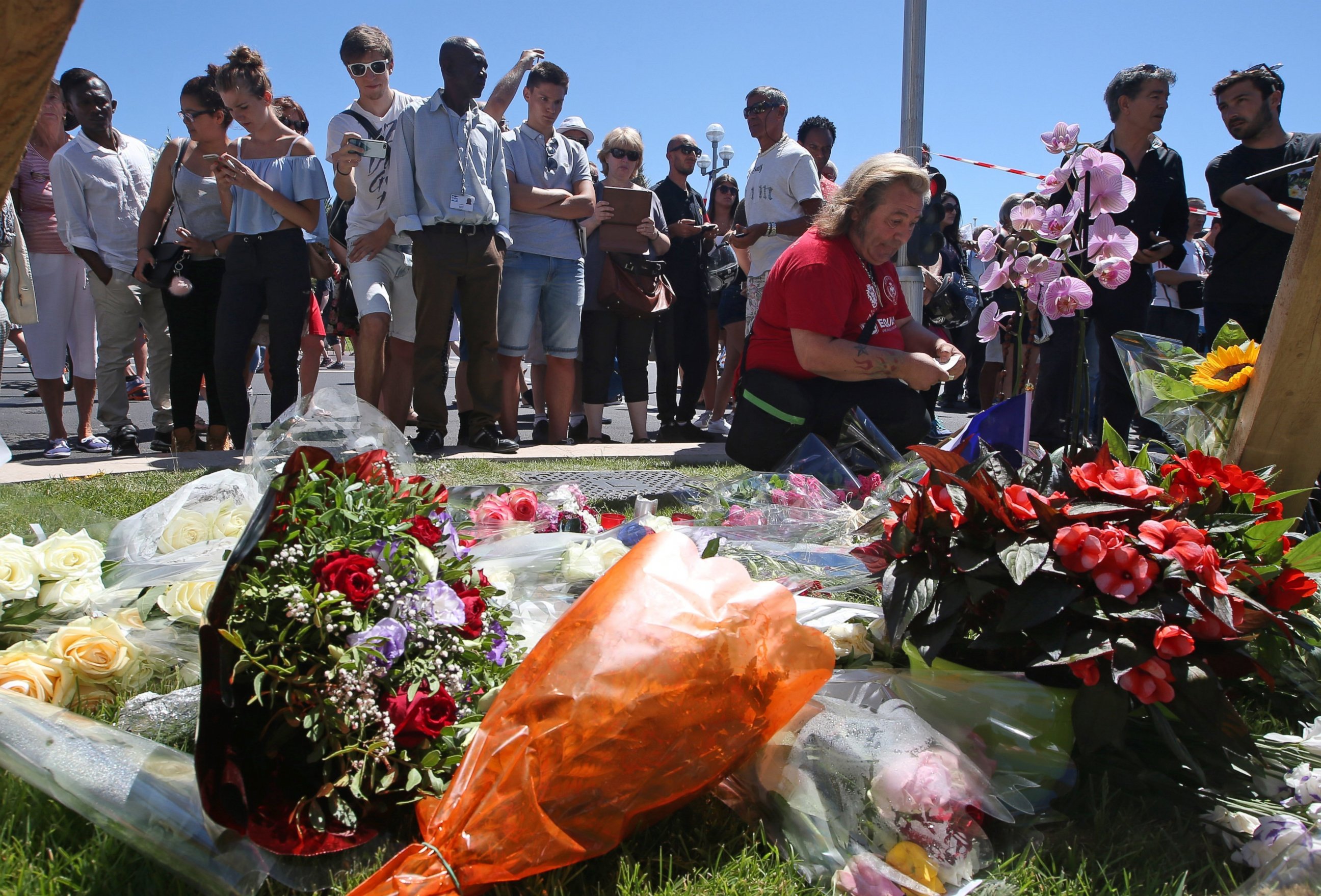 PHOTO: Floral tributes are laid out near the site of the truck attack in the French resort city of Nice, France, July 15, 2016.