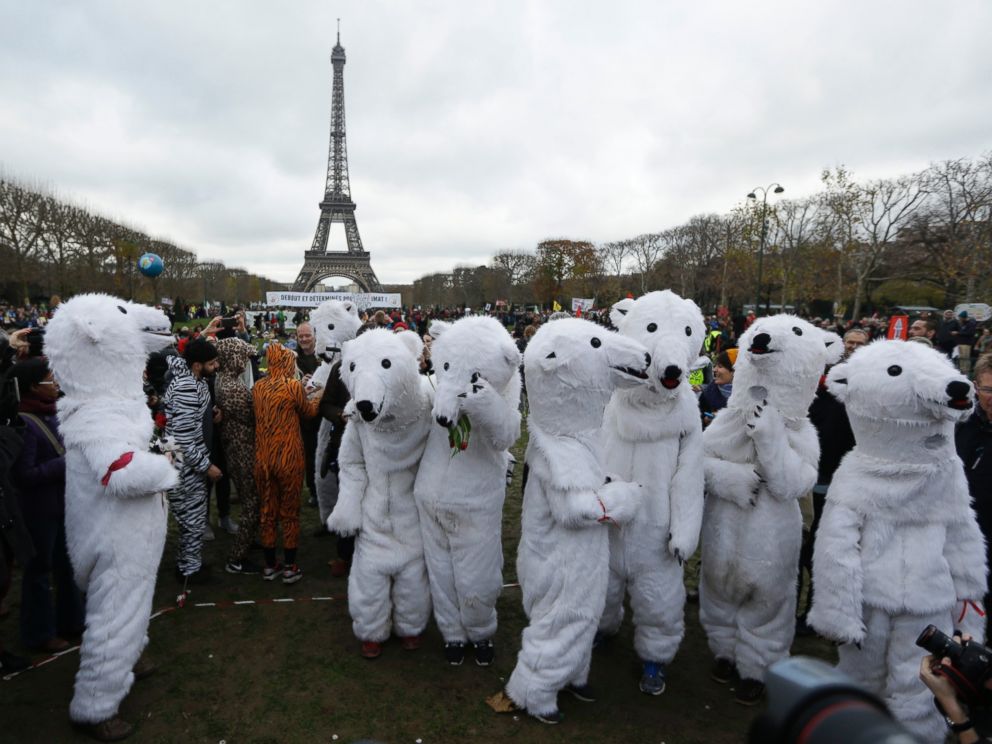 PHOTO: White bears costumed activists demonstrate near the Eiffel Tower, in Paris, Dec.12, 2015 during the COP21, the United Nations Climate Change Conference.