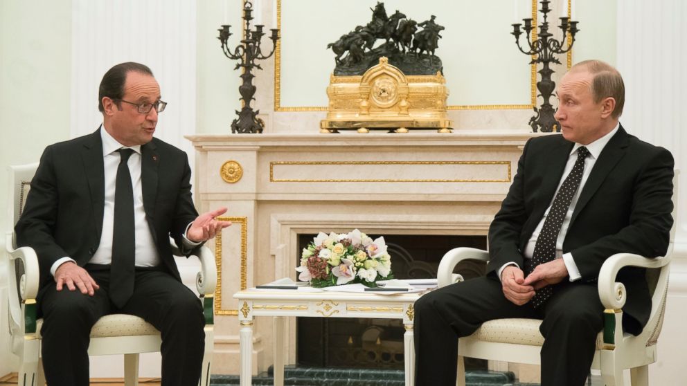 Russian President Vladimir Putin, right, listens to France's President Francois Hollande during their meeting in Moscow, Russia, Nov. 26, 2015. 