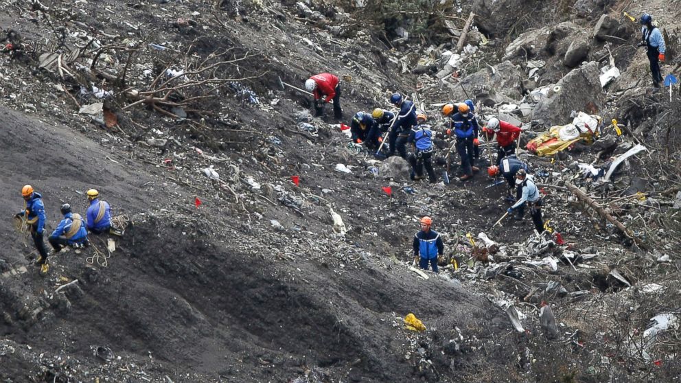 PHOTO: Rescue workers work at debris of the Germanwings jet at the crash site near Seyne-les-Alpes, France, March 26, 2015.