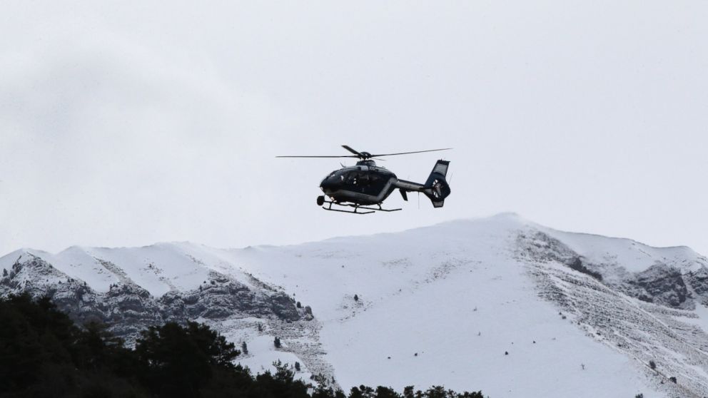 PHOTO: A rescue helicopter flies over mountains near Seyne-les-Alpes, France, to search for the 150 victims who died in a Germanwings plane crash in the French Alps, March 25, 2015.