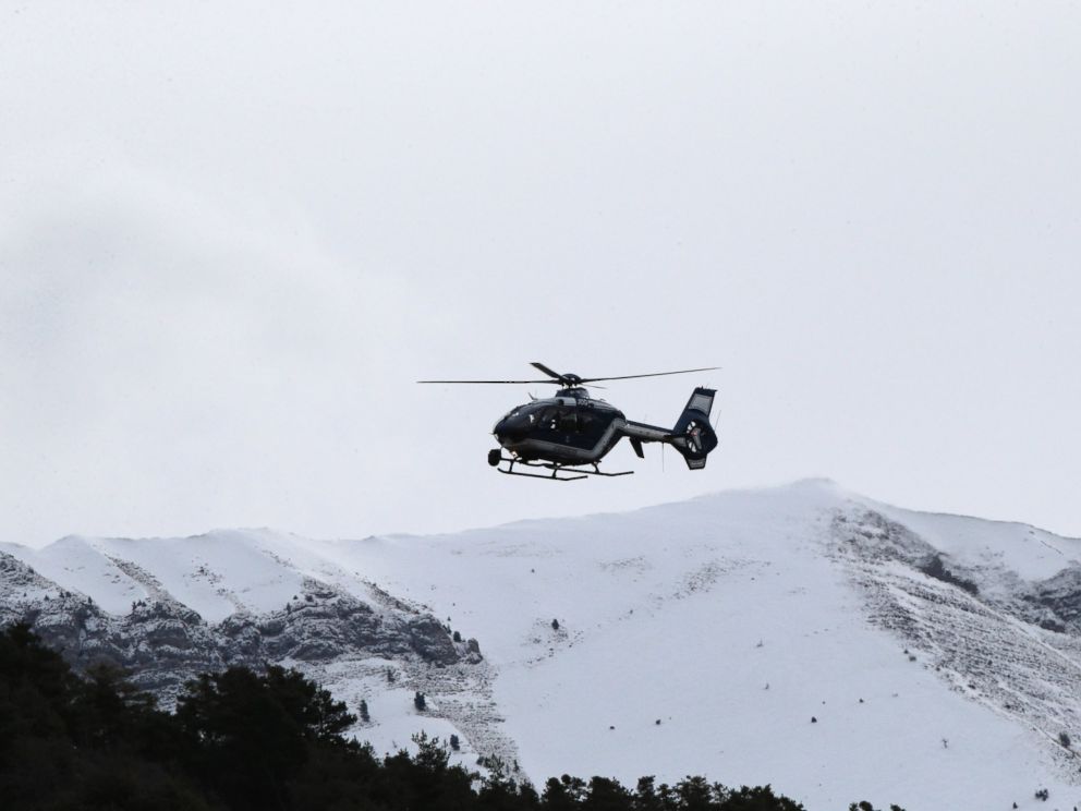 PHOTO: A rescue helicopter flies over mountains near Seyne-les-Alpes, France, to search for the 150 victims who died in a Germanwings plane crash in the French Alps, March 25, 2015.