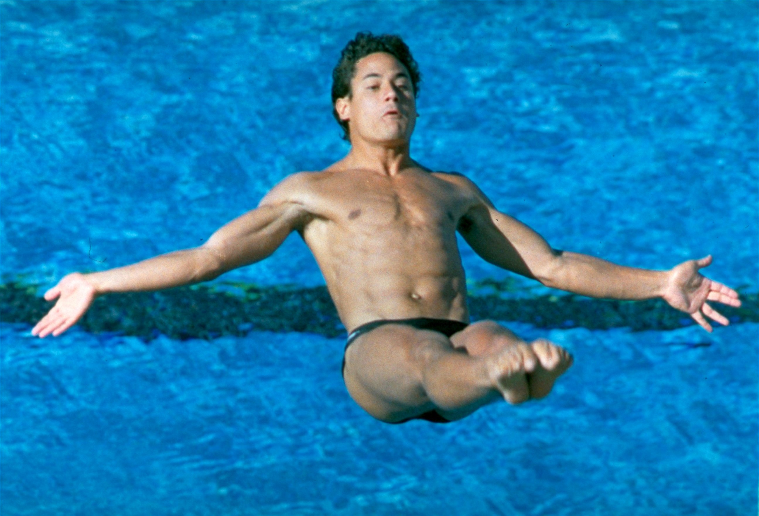 PHOTO: Diver Greg Louganis does a back 2 1/2 somersault from the tuck position during the springboard preliminaries, Aug. 7, 1984, during the Summer Olympics in Los Angeles.