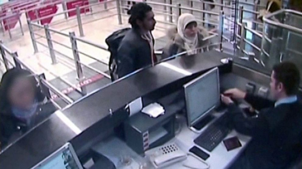 Turkish media reported that video has emerged apparently showing Hayat Boumeddiene, right, traveling through Istanbul airport, Jan. 2, 2015 next to an unidentified man, left.