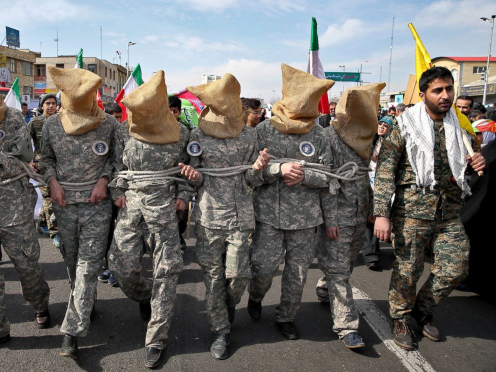 PHOTO: Members of Iranian Basij paramilitary force reenact the January capture of U.S sailors by the Revolutionary Guard in the Persian Gulf, in a rally commemorating the 37th anniversary of Islamic Revolution in Tehran, Iran, Feb. 11, 2016.