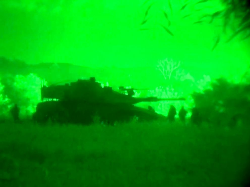 PHOTO: This image made from video shot through a night vision scope released by the Israeli military, July 18, 2014, shows a tank in the Gaza Strip during a ground offensive.