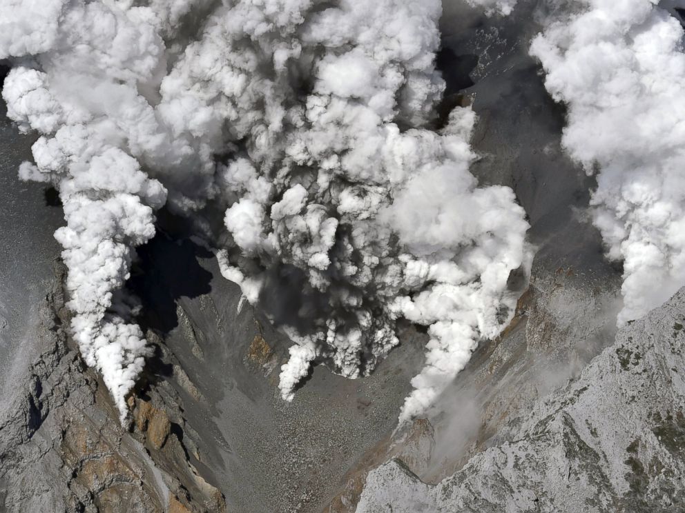PHOTO: Dense fumes are spewed out from several spots on the slope of Mt. Ontake as the volcano erupts in central Japan, Sept. 27, 2014.