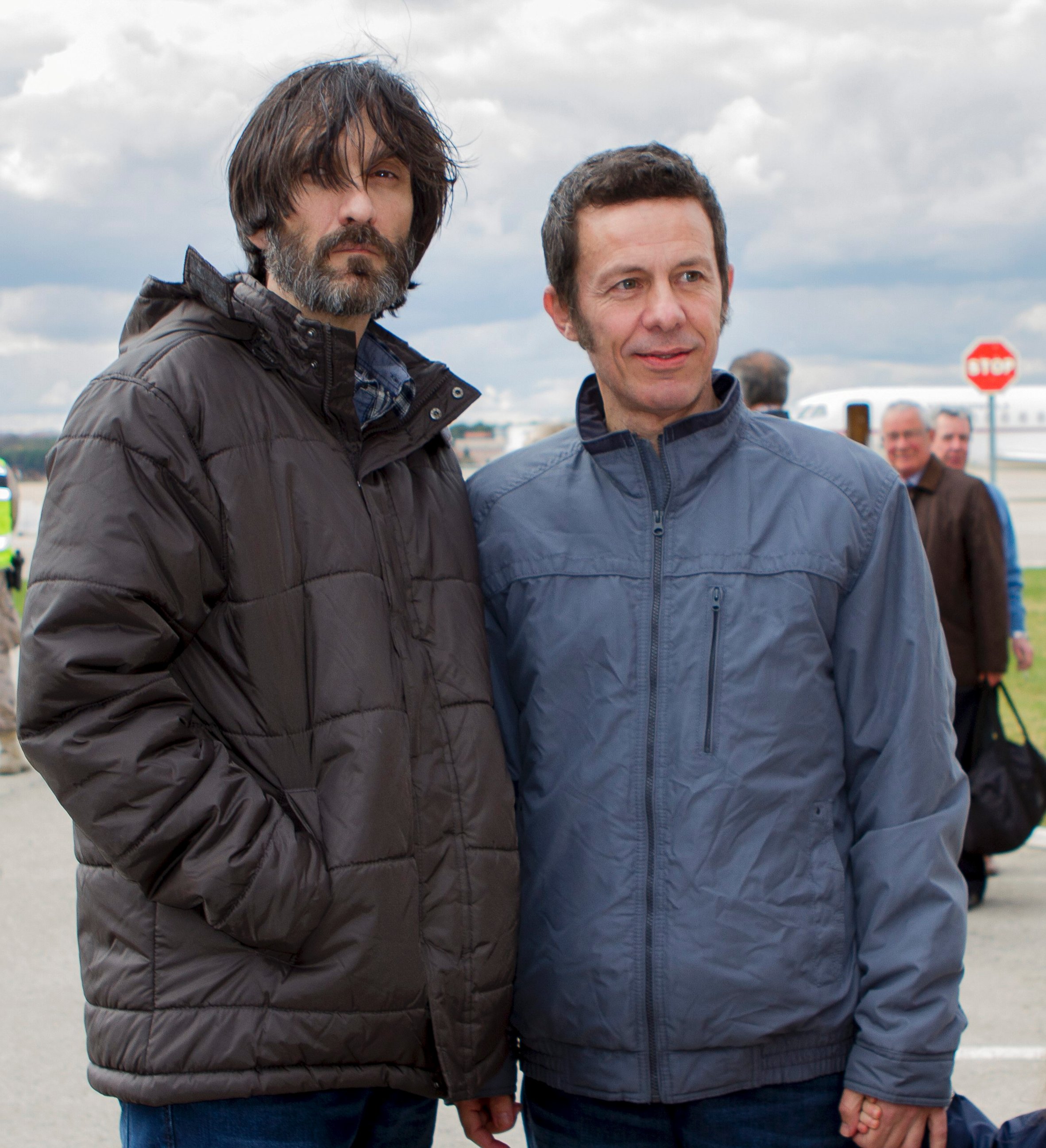 PHOTO: Spanish reporters Javier Espinosa, right, and Ricardo Garcia Vilanova, left, poses upon their arrival at the military airbase in Torrejon de Ardoz, Madrid, Sunday, March 30, 2014. 