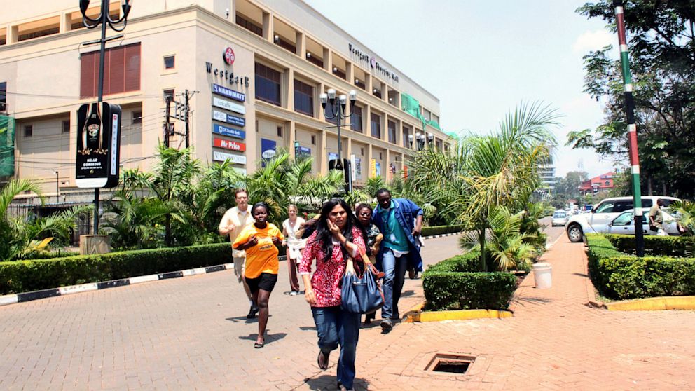 People run from the Westgate Mall in Nairobi, Kenya on Saturday Sept. 21 2013, after gunmen threw grenades and opened fire during an attack that left multiple dead and dozens wounded. 
