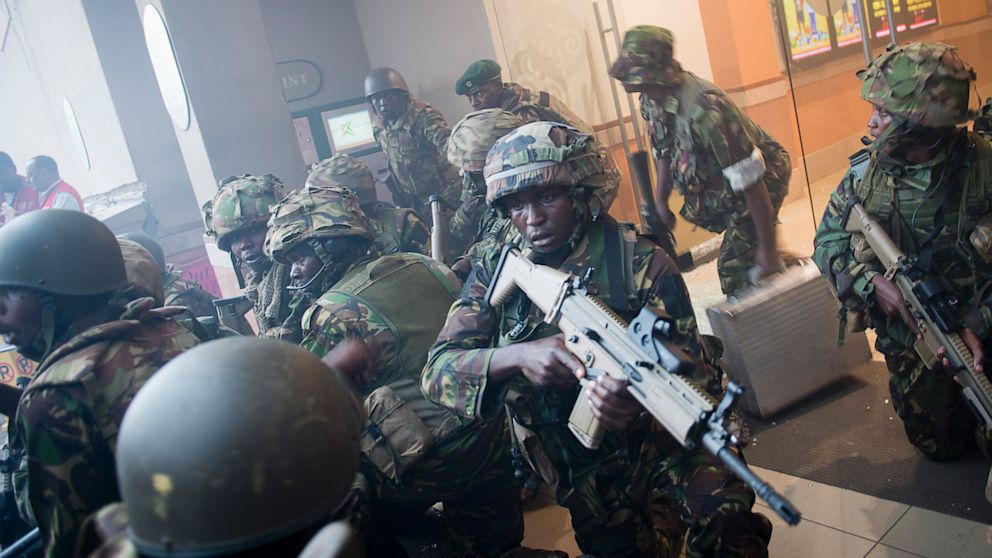 Armed police leave after entering the Westgate Mall in Nairobi, Kenya Saturday, Sept. 21, 2013. Gunmen threw grenades and opened fire Saturday, killing at least 22 people in an attack targeting non-Muslims at an upscale mall in Kenya's capital that was hosting a children's day event, a Red Cross official and witnesses said. (AP Photo/Jonathan Kalan)