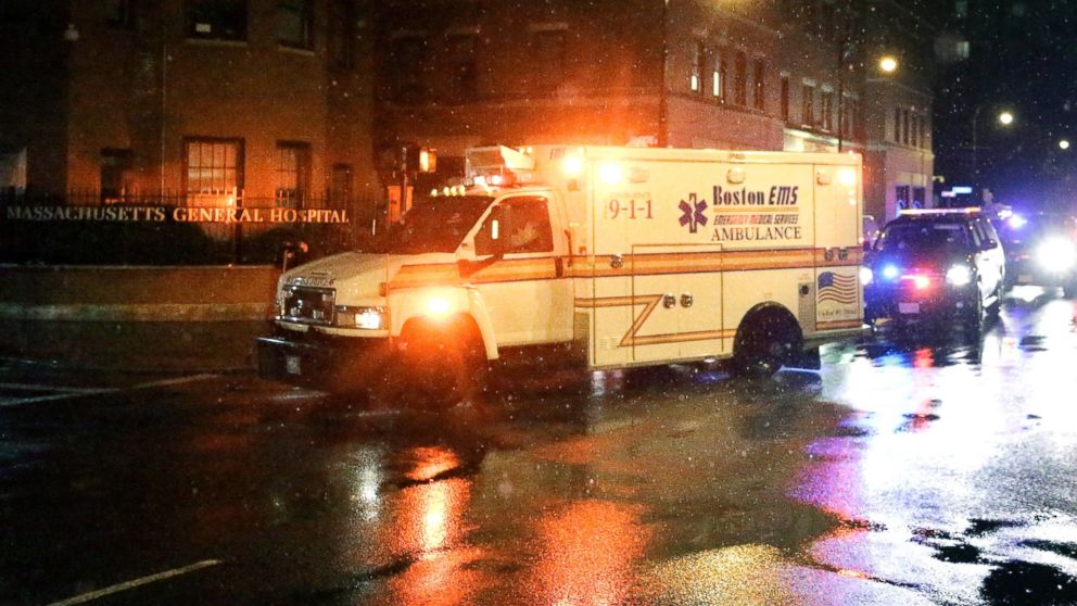 An ambulance forms part of a motorcade transporting U.S. Secretary of State John Kerry as it arrives at Massachusetts General Hospital, June 1, 2015, in Boston.