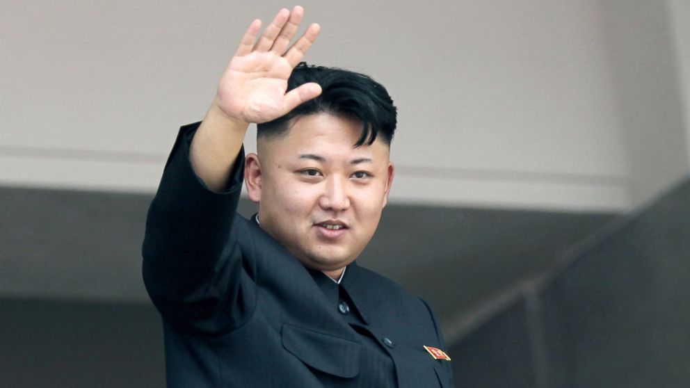 North Korea's leader Kim Jong Un waves to spectators and participants of a mass military parade, July 27, 2013, in Pyongyang, North Korea. 