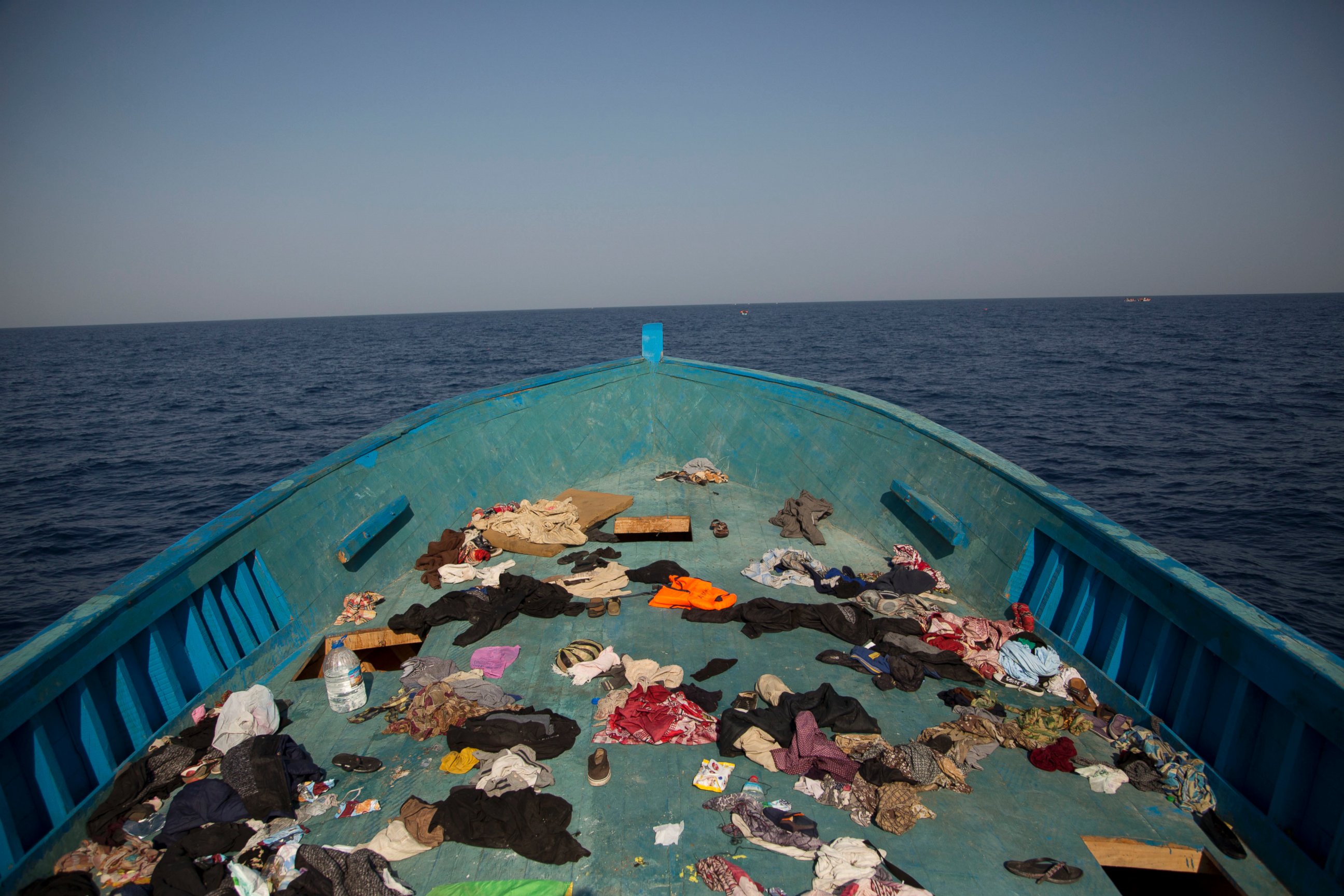 PHOTO: Belongings left behind by migrants are seen in the floor of a wooden boat where more than seven hundred migrants were fleeing Libya, during a rescue operation in the Mediterranean sea, about 13 miles north of Sabratha, Libya, Aug. 29, 2016. 