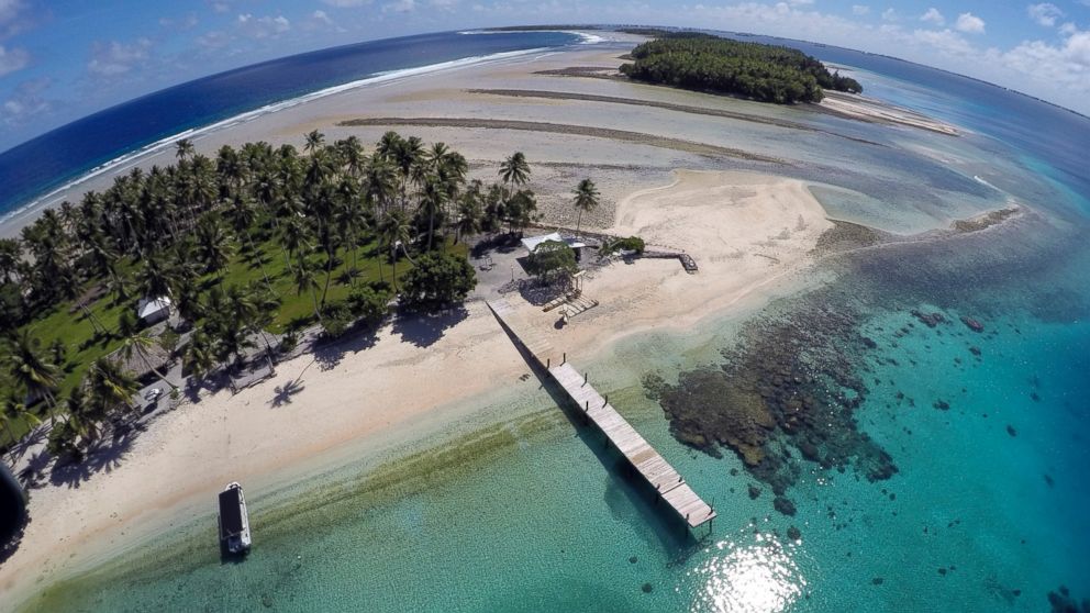 PHOTO: This Nov. 8, 2015 aerial file photo shows a small section of the atoll that has slipped beneath the water line only showing a small pile of rocks at low tide on Majuro Atoll in the Marshall Islands. 
