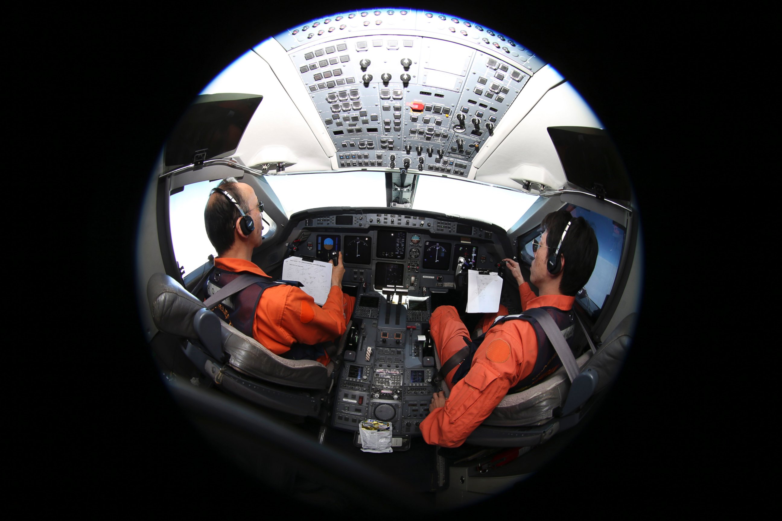 PHOTO: Captain of the Japan Coast Guard Gulfstream Makoto Hoshi, left, and his co-pilot Shunichi Yumiza sit in the cockpit during a search for the missing Malaysia Airlines Flight MH370 in the Southern Indian Ocean, near Australia, April 1, 2014. 
