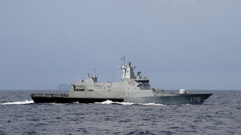 Royal Malaysian Navy's offshore patrol vessel KD Kelantan leaves for southern corridor during a search and rescue operation for the missing Malaysia Airlines plane, off Lumut Naval Base in Lumut Island, Malaysia, March 17, 2014. 