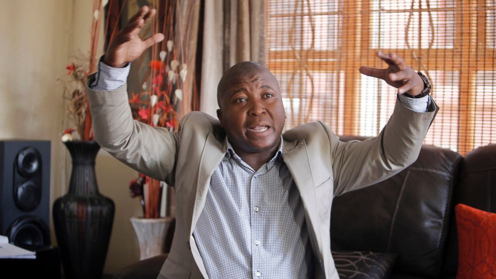 Thamsanqa Jantjie gesticulates at his home during an interview with the Associated Press in Johannesburg, Dec. 12, 2013. 