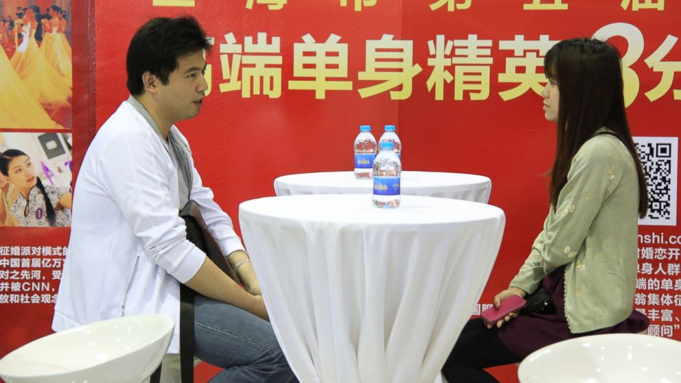 PHOTO: A pair of unmarried participants talk with each other at a massive matchmaking event in Shanghai, China, May 24, 2014. 
