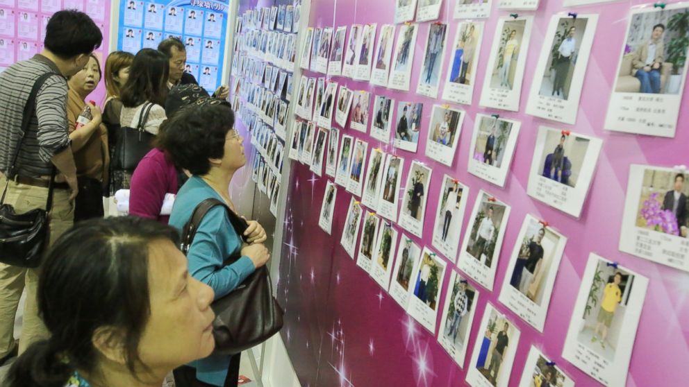 PHOTO: Chinese parents view photos and personal information of male participants for their unmarried daughters at a massive matchmaking event in Shanghai, China, May 24, 2014.

