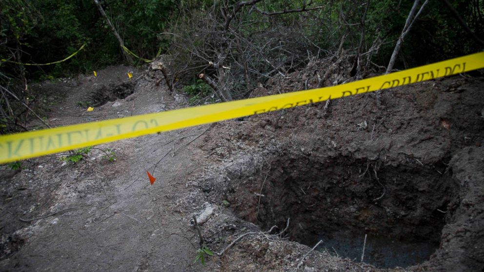 PHOTO: In this Oct. 6, 2014 file photo, clandestine graves are taped off after 28 bodies were found in them near Iguala, Mexico.
