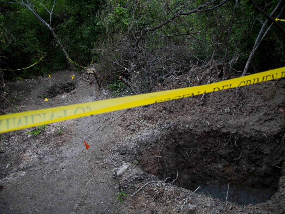 PHOTO: In this Oct. 6, 2014 file photo, clandestine graves are taped off after 28 bodies were found in them near Iguala, Mexico.