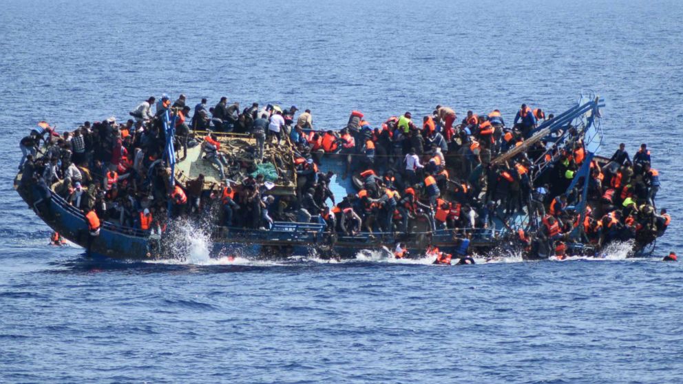 PHOTO:People jump out of a boat right before it overturns off the Libyan coast, May 25, 2016.   