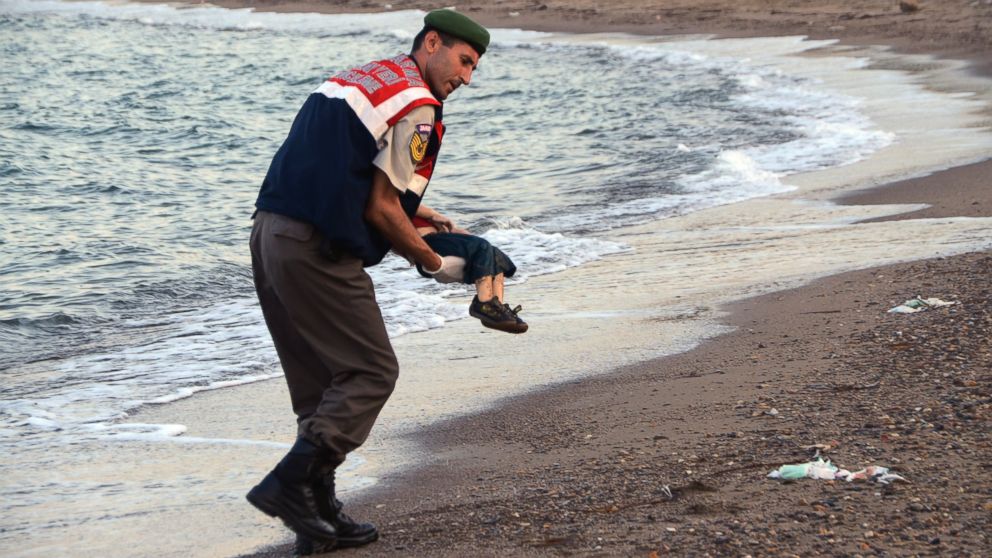 PHOTO:A paramilitary police officer carries the lifeless body of a migrant child after a number of migrants died after boats carrying them to the Greek island of Kos capsized,  Sept. 2, 2015. 