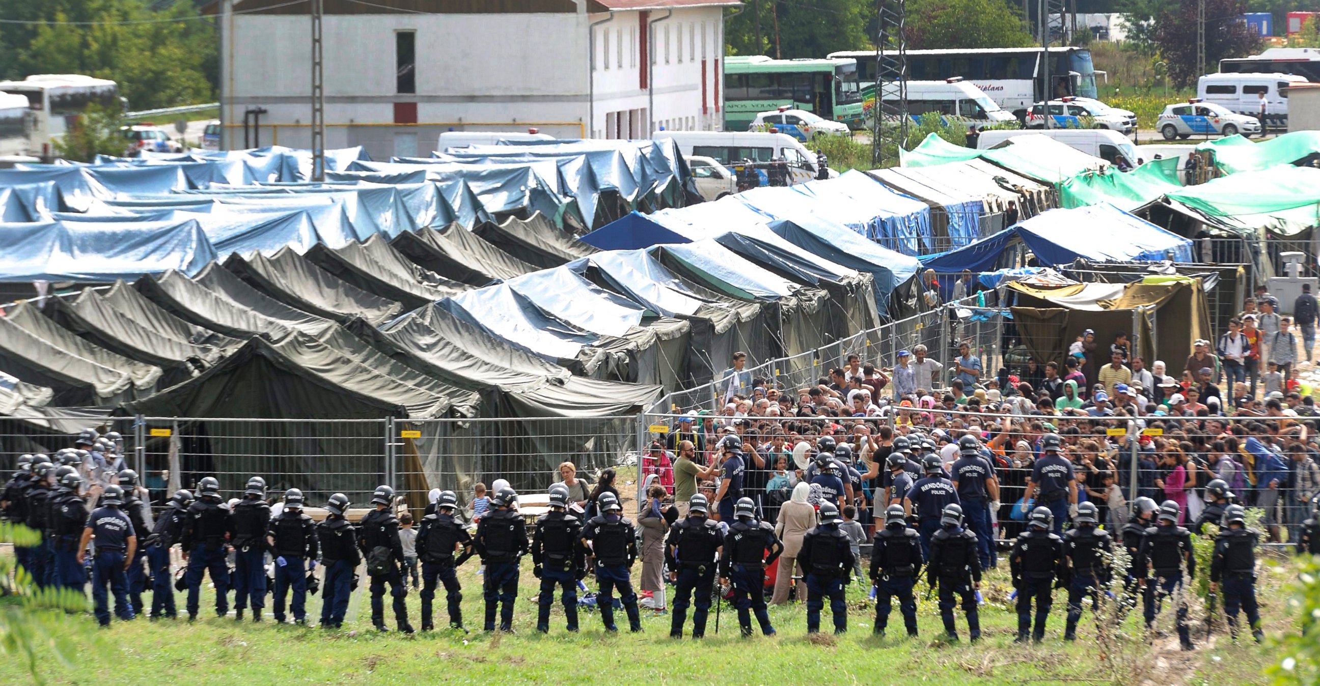 PHOTO: Migrants and Hungarian police officers confront each other at the reception center, in Roszke, southeast from Budapest, Hungary, Sept. 4, 2015, after people broke out of the center.  