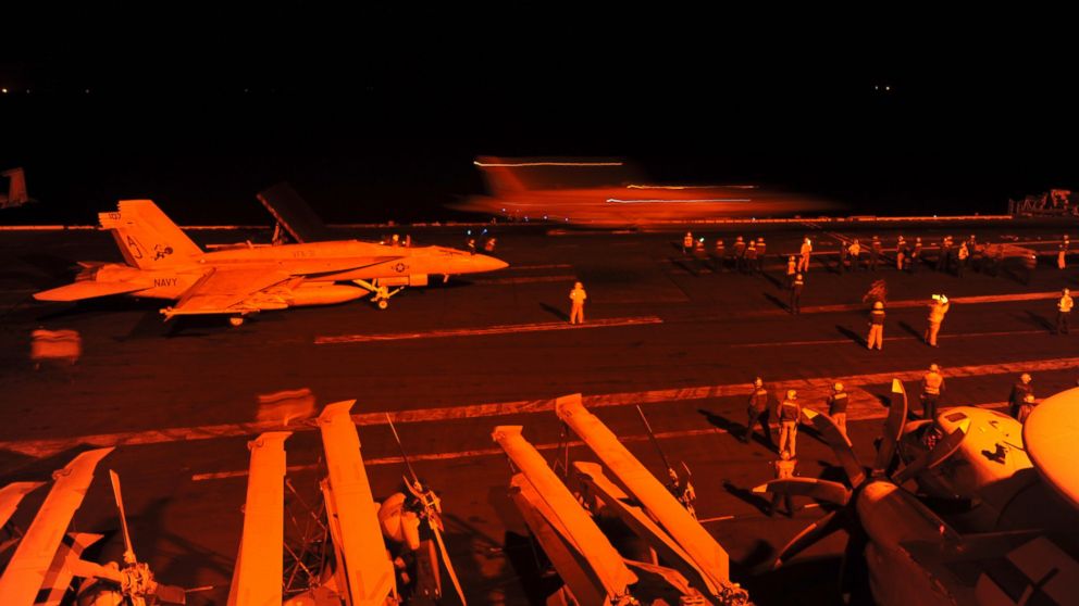 PHOTO: A-18E Super Hornet, prepares to launch from the flight deck of the aircraft carrier USS George H.W. Bush  to conduct strike missions against Islamic State group targets, in the Arabian Gulf, Sept. 23, 2014.