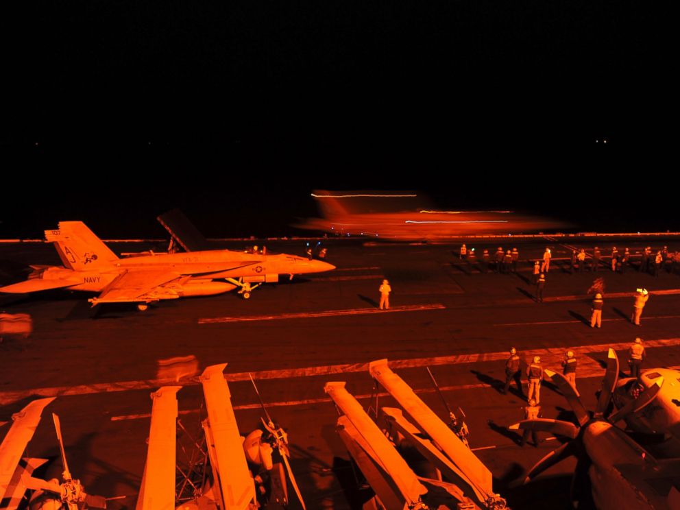 PHOTO: A-18E Super Hornet, prepares to launch from the flight deck of the aircraft carrier USS George H.W. Bush to conduct strike missions against Islamic State group targets, in the Arabian Gulf, Sept. 23, 2014.