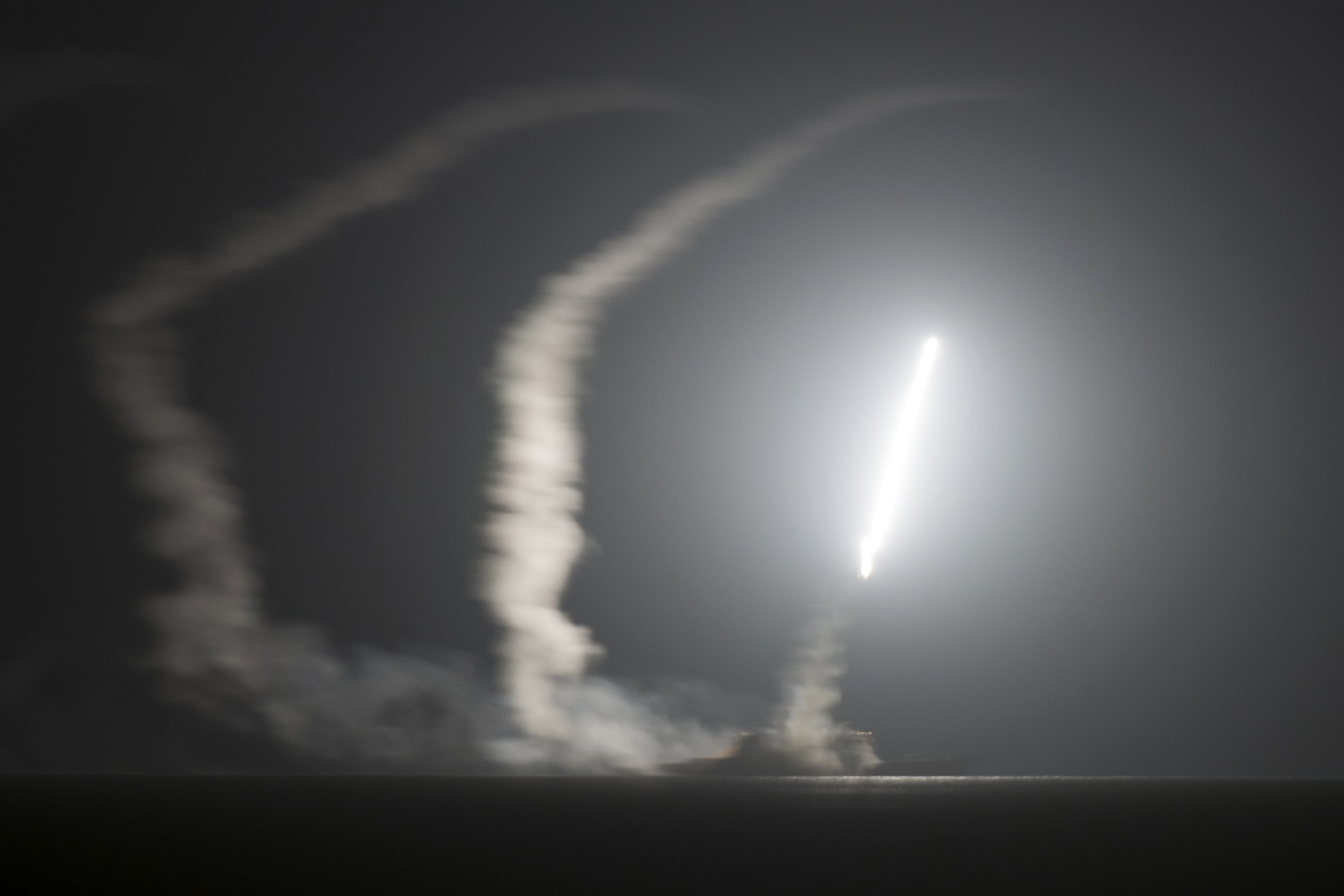PHOTO: The guided-missile cruiser USS Philippine Sea launches a Tomahawk cruise missile at Islamic State group positions in Syria as seen from the aircraft carrier USS George H.W. Bush on the Arabian Gulf, Sept. 23, 2014.