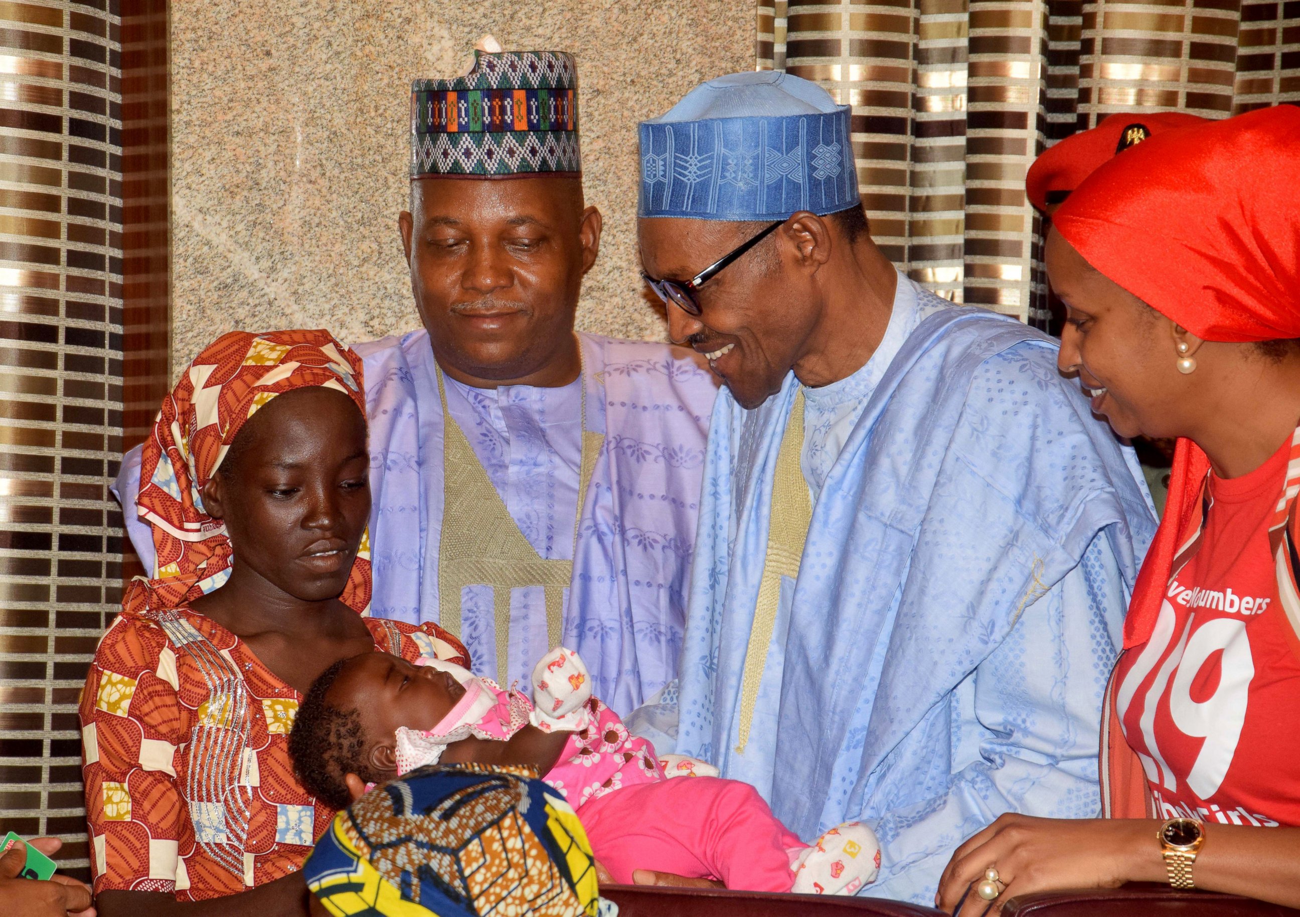 PHOTO: Nigeria President Muhammadu Buhari, second right, receives Amina Ali, the rescued Chibok school girl, at the Presidential palace in Abuja, Nigeria, May. 19, 2016.