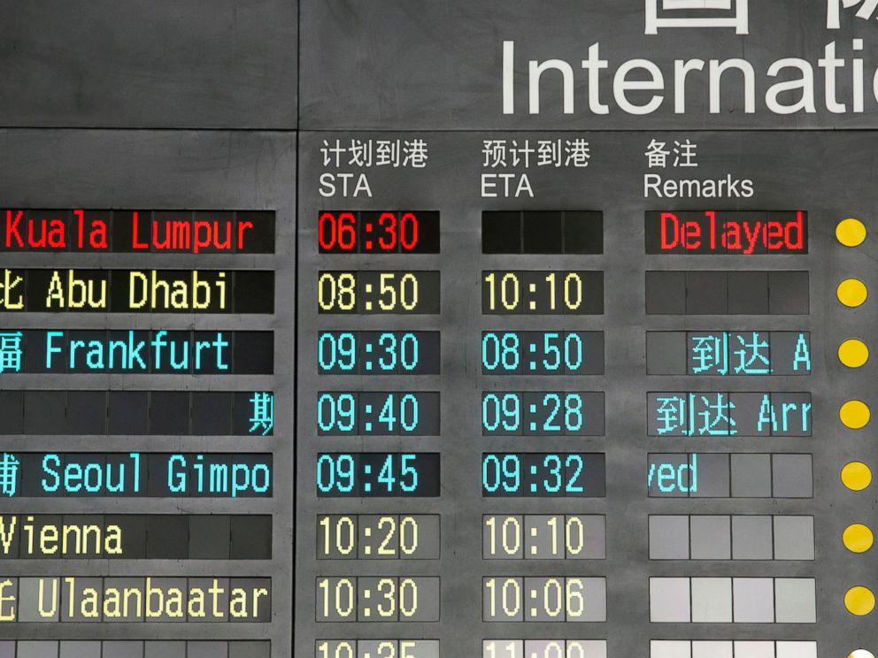 PHOTO: The arrival board at the International Airport in Beijing, China shows a Malaysian airliner is delayed, Saturday, March 8, 2014.