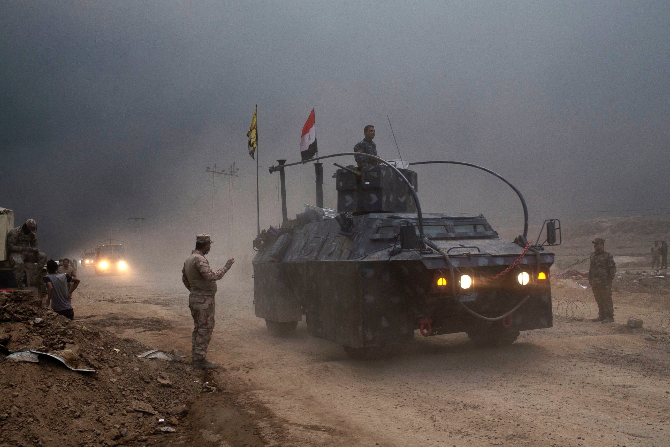PHOTO: An Iraqi Federal Police vehicle passes through a checkpoint in Qayara, some 31 miles, 50 km, south of Mosul, Iraq, Oct. 26, 2016.