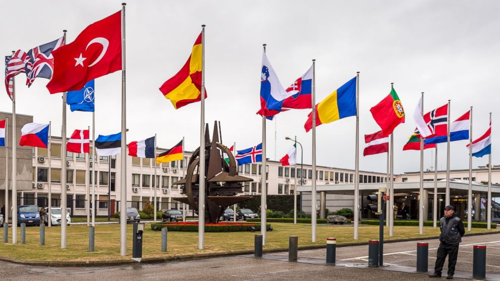 NATO country flags wave outside NATO headquarters in Brussels, July 28, 2015.