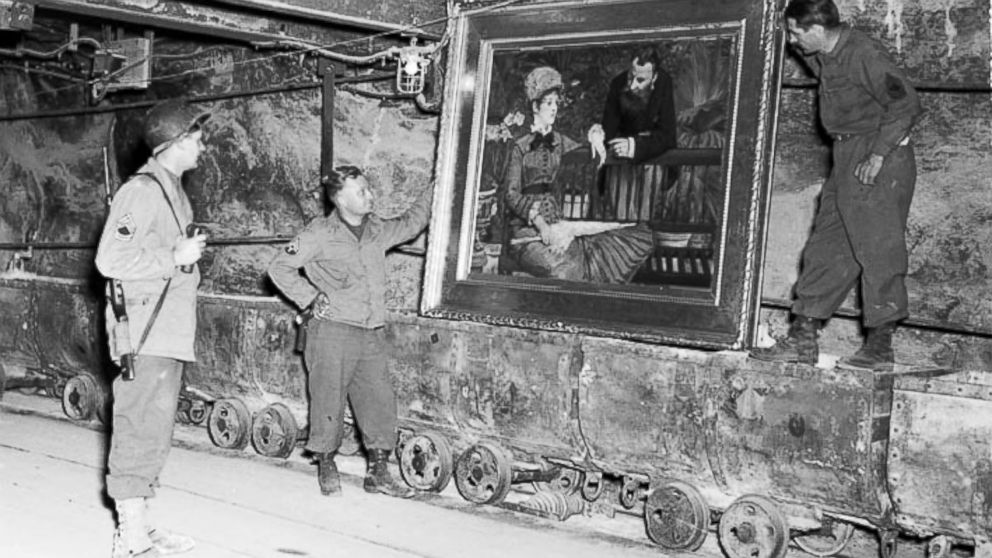 PHOTO: In this April 25, 1945 image released by the U.S. National Archives, U.S. Army personnel stand by a painting called, "Wintergarden," by French impressionist Edouard Manet, which was discovered in the vault in Merkers, Germany.