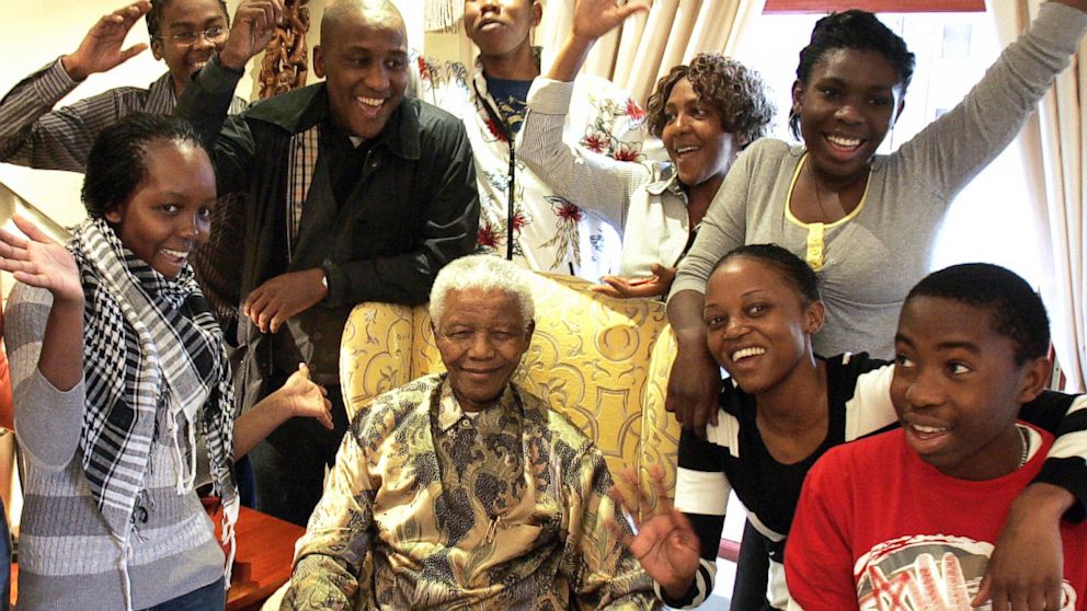Former South African President Nelson Mandela poses with his grandchildren at his home in Qunu, South Africa, July 18, 2008.