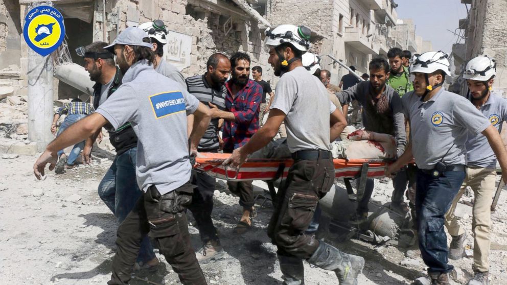 PHOTO: Syrian Civil Defense White Helmets, rescue workers work the site of airstrikes in the al-Sakhour neighborhood of the rebel-held part of eastern Aleppo, Syria. 