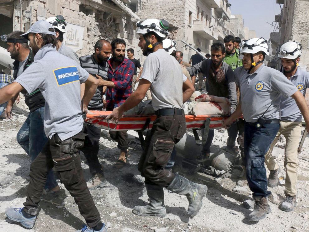 PHOTO: Syrian Civil Defense White Helmets, rescue workers work the site of airstrikes in the al-Sakhour neighborhood of the rebel-held part of eastern Aleppo, Syria.